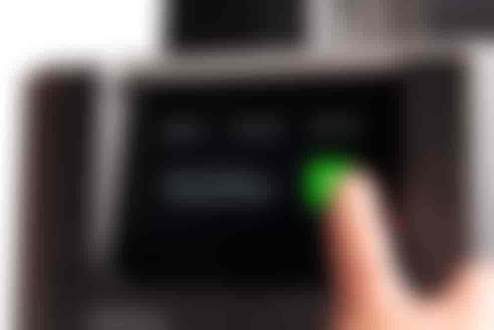 Miniatures of chess pieces next to a penny for scale